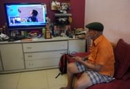 Ramakant Achrekar watching Tendulkar score his 100th century at his house in Mumbai on March 16, 2012.